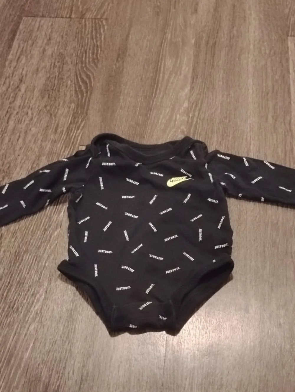 Black Infant Long Sleeve Onesie In Size Newborn
